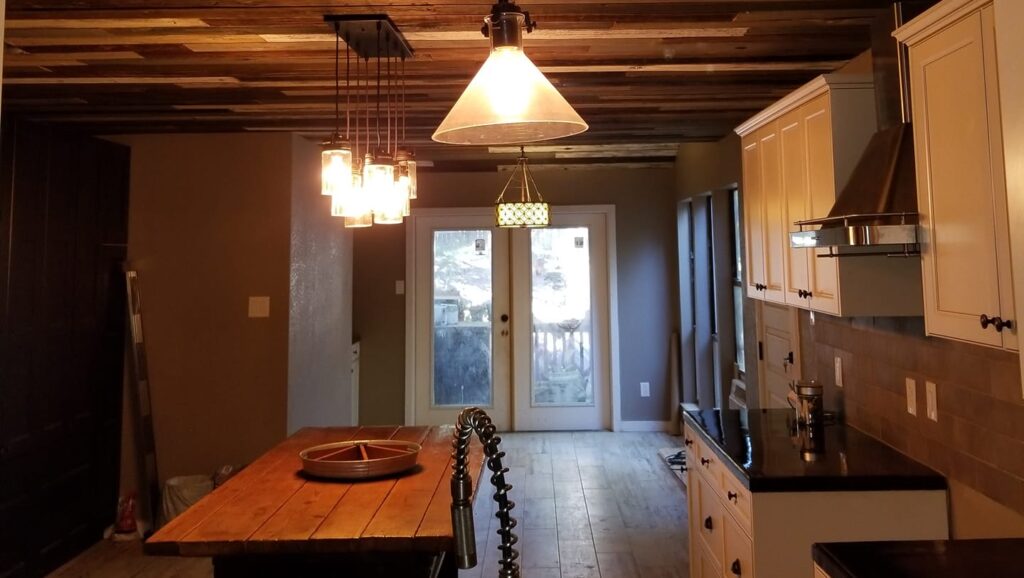 custom pendant lighting and wooden ceiling in a kitchen remodel